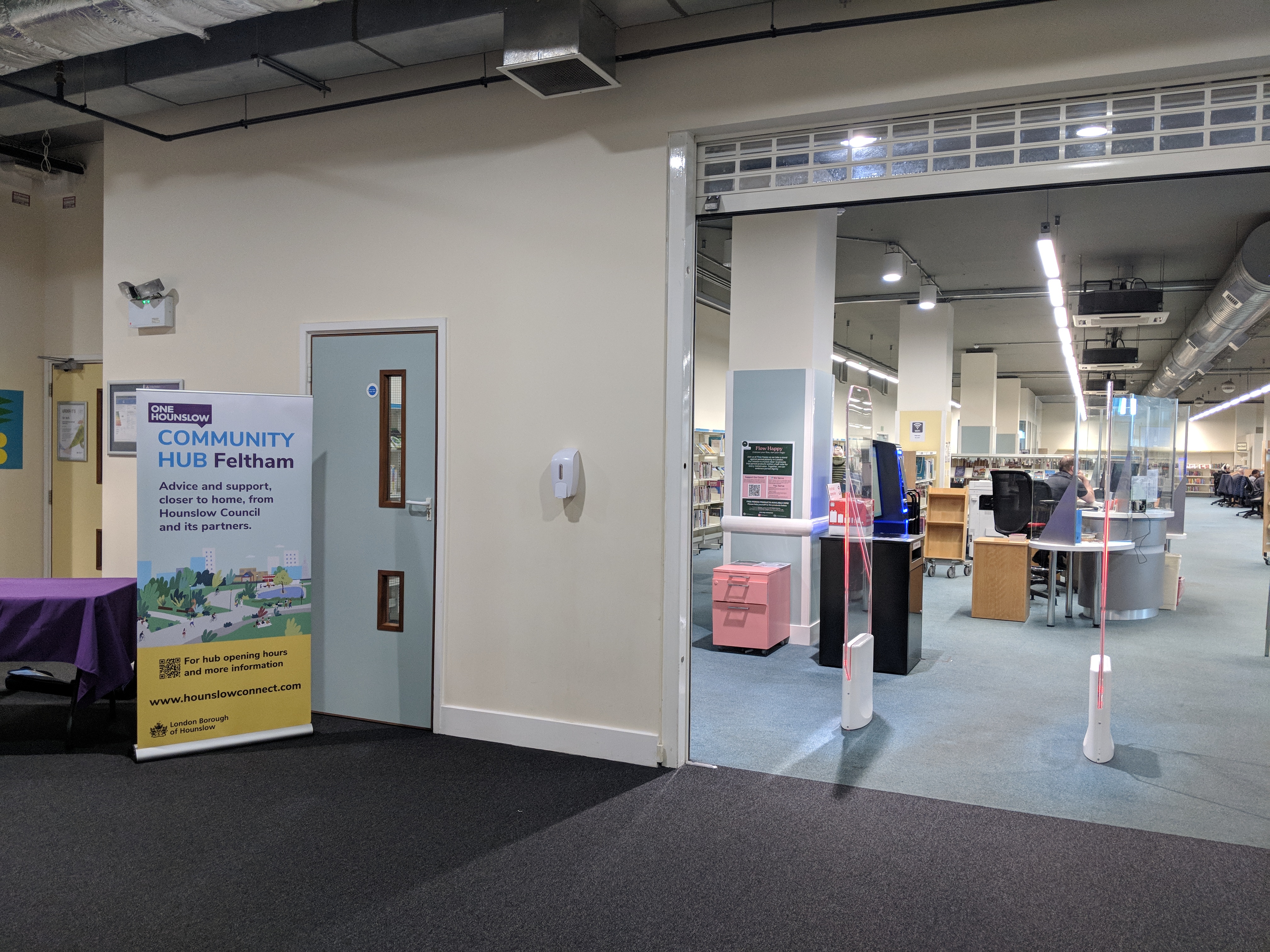 Feltham Library entrance with Community Hub banner